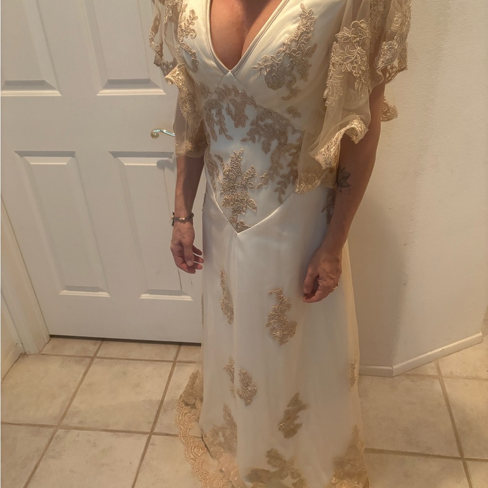 Elegant Cream and Gold Gown with Lace Details